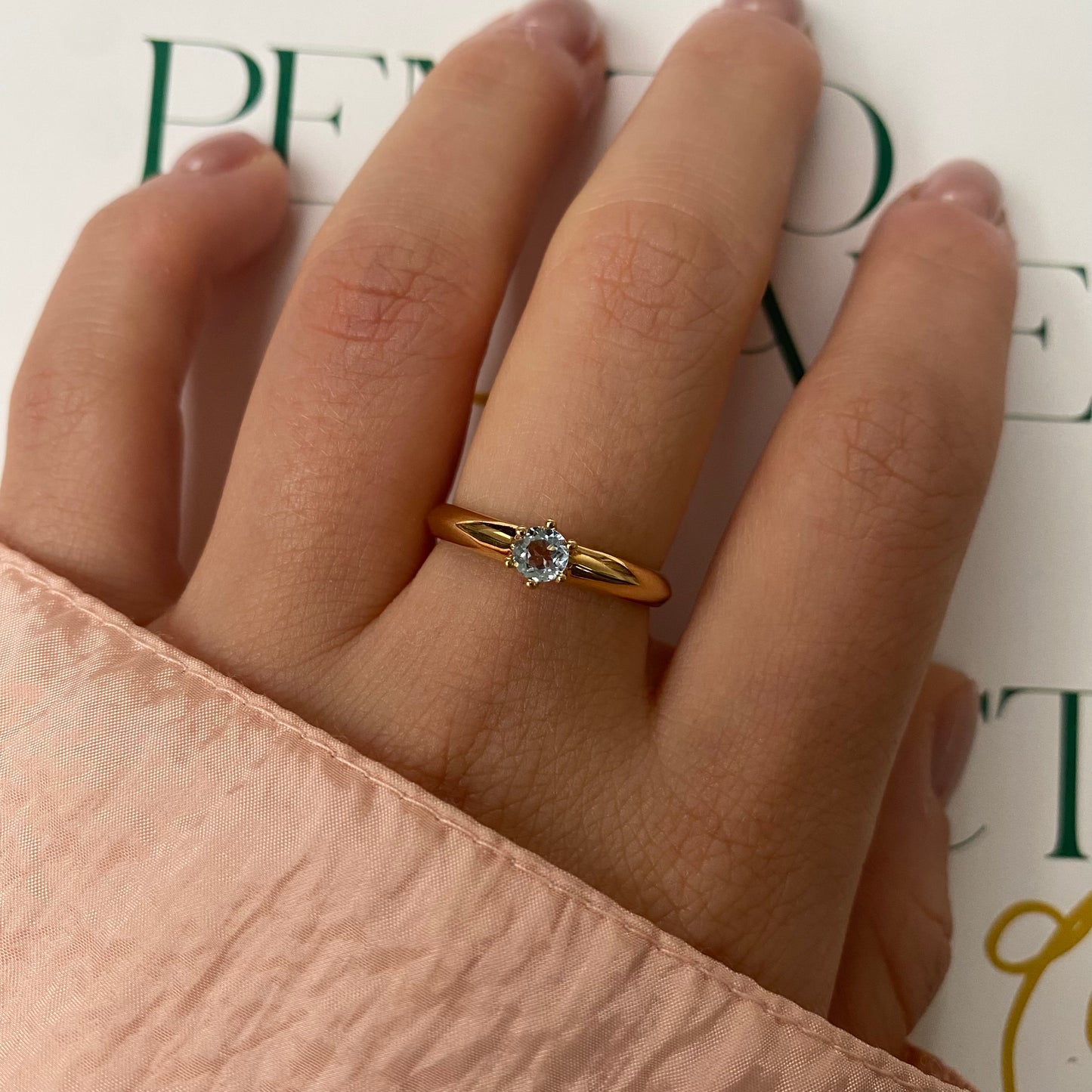 14 carat gold ring with solitaire light blue spinel
