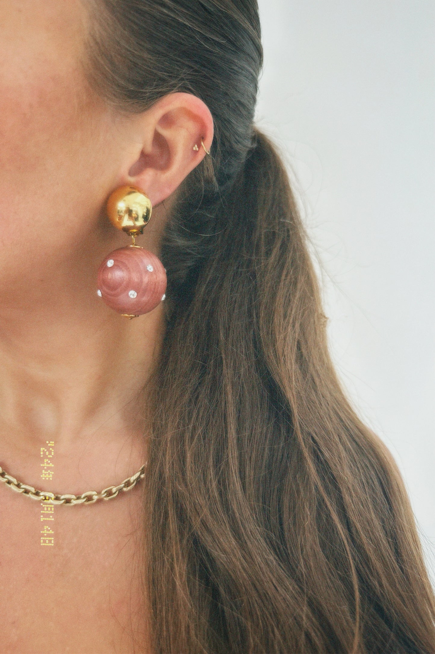 Vintage gold tone dome with dangling wooden ball clip on earrings