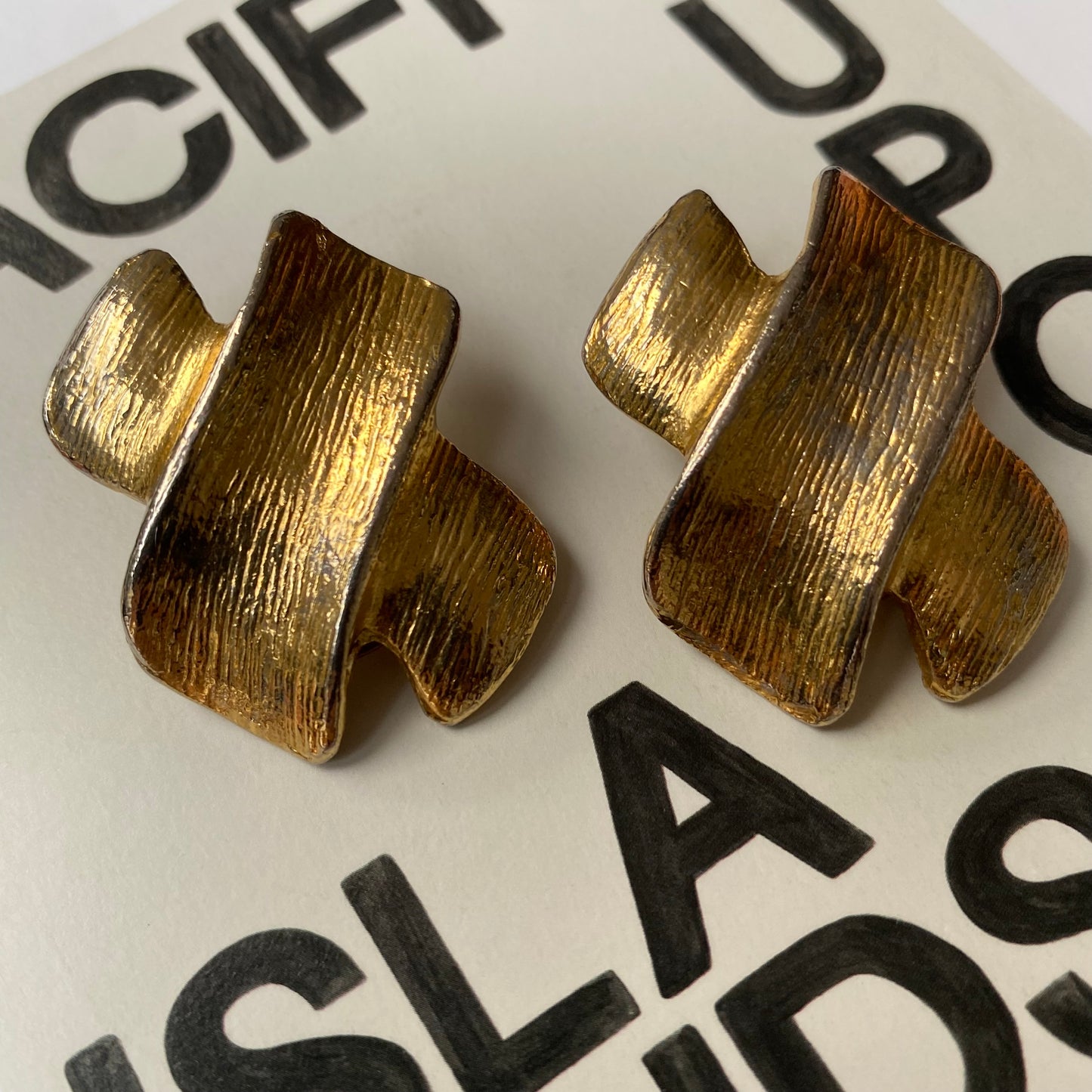 Vintage metal gold tone clean cross clip on earrings