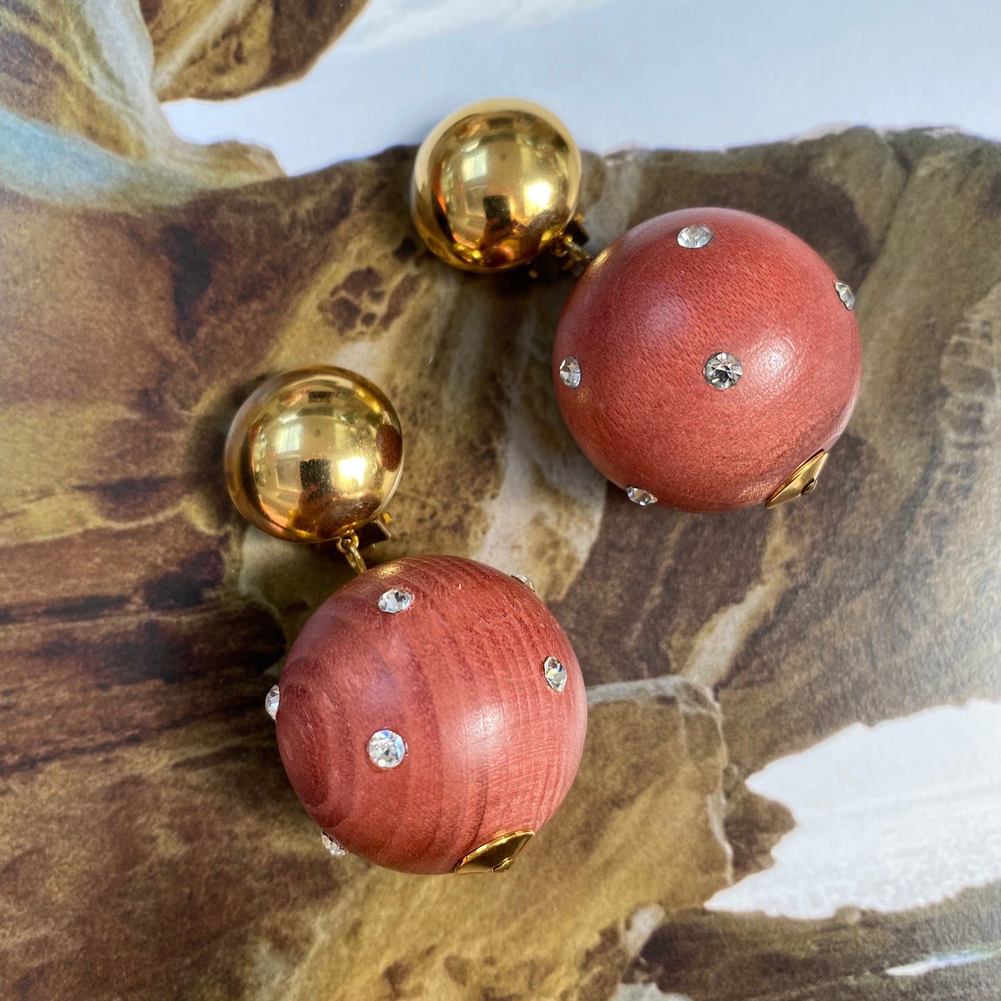 Vintage gold tone dome with dangling wooden ball clip on earrings