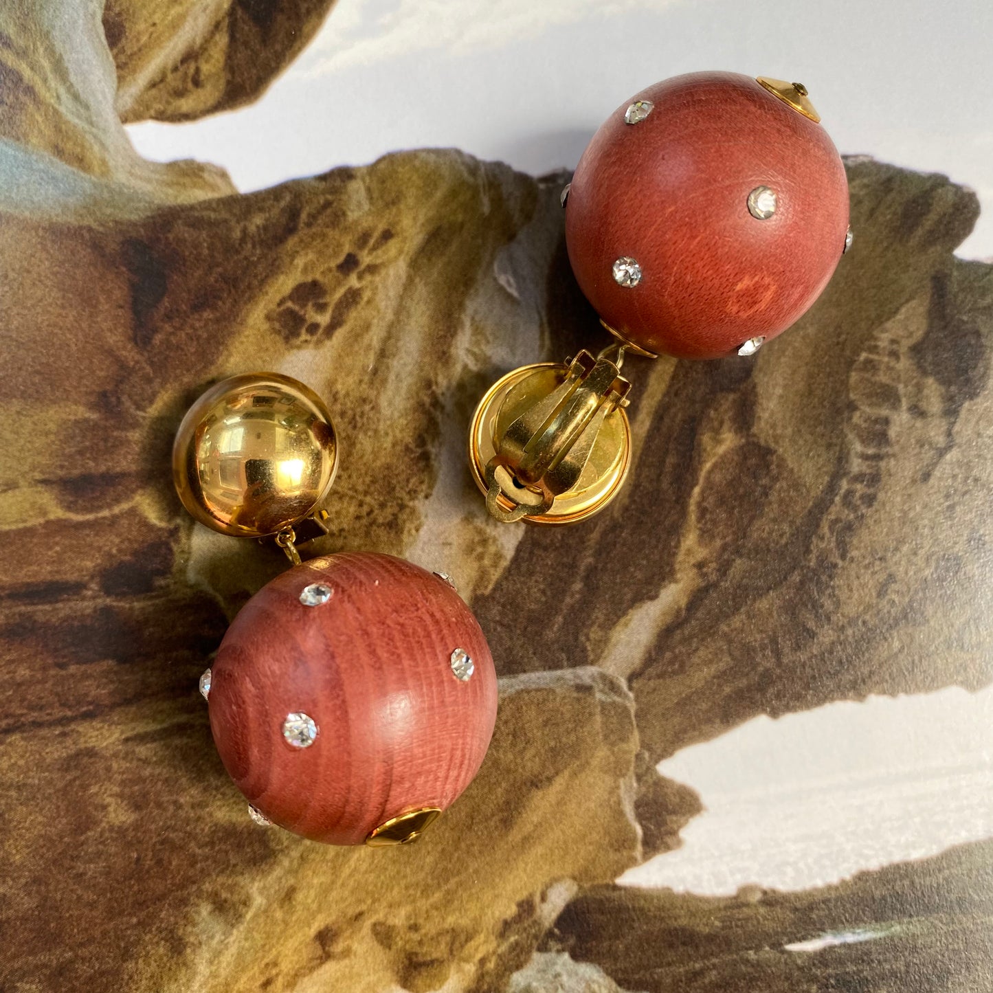 Vintage gold tone dome with dangling wooden ball clip on earrings