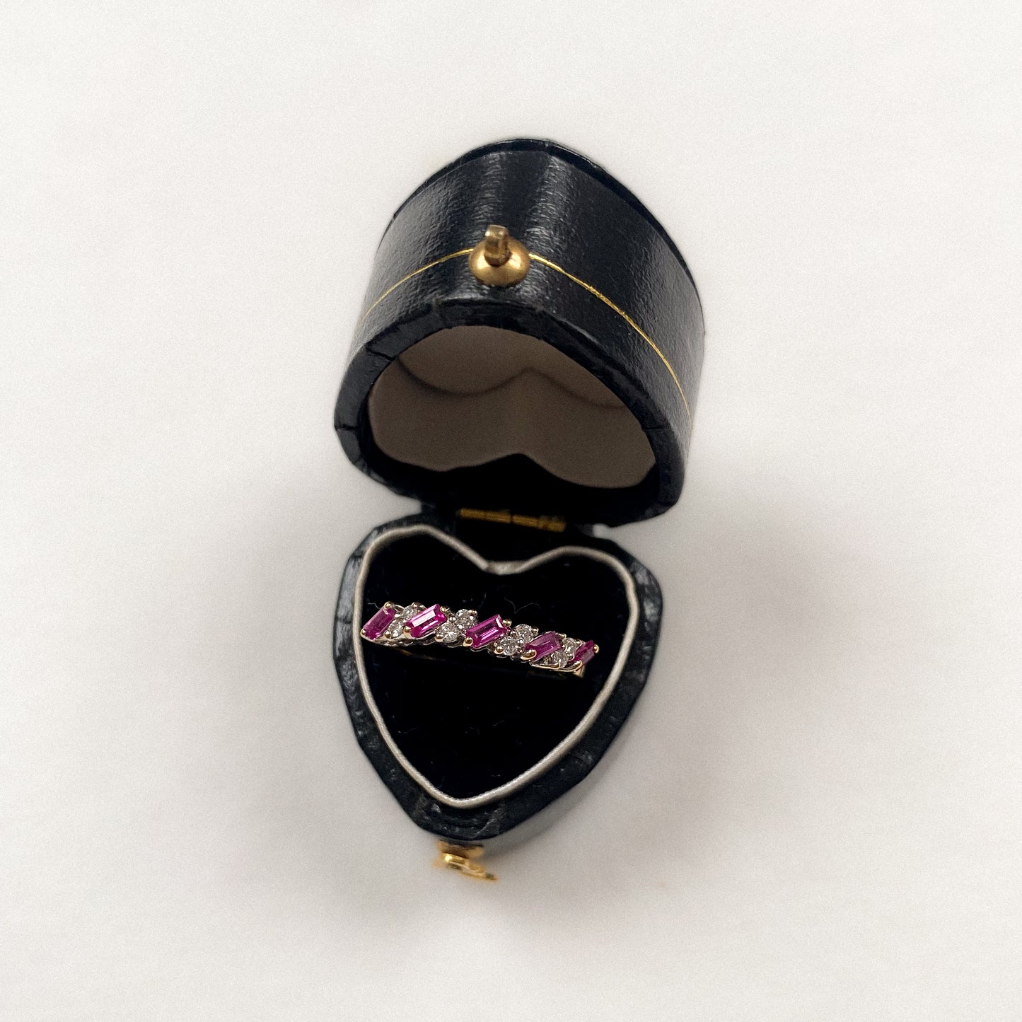 18 carat gold ruby and diamond half eternity ring