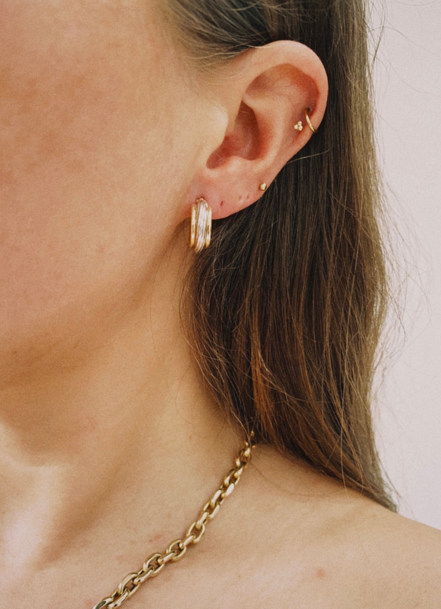 14 carat yellow and white gold triple hoops
