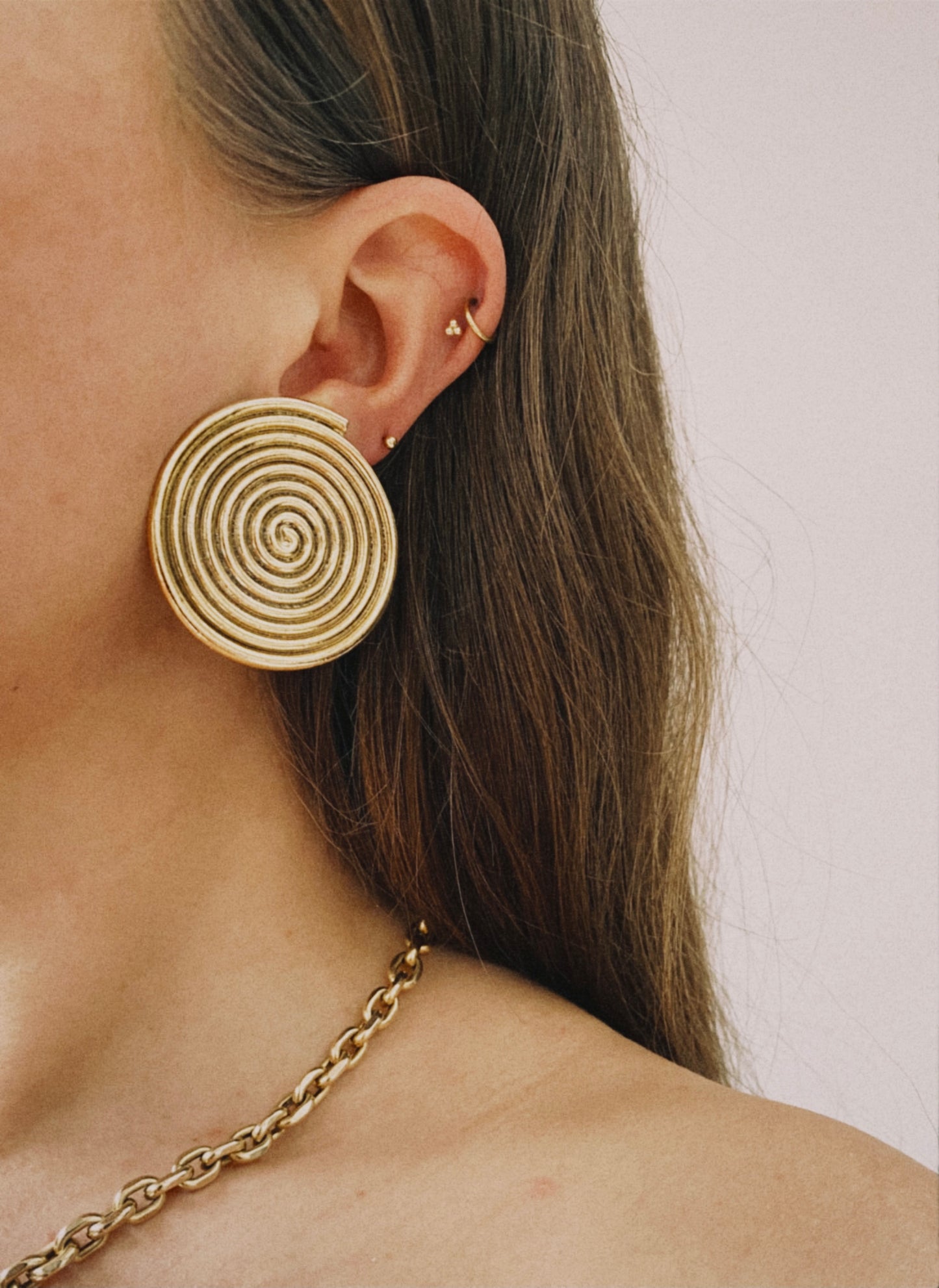 Vintage gold tone round swirl clip on earrings