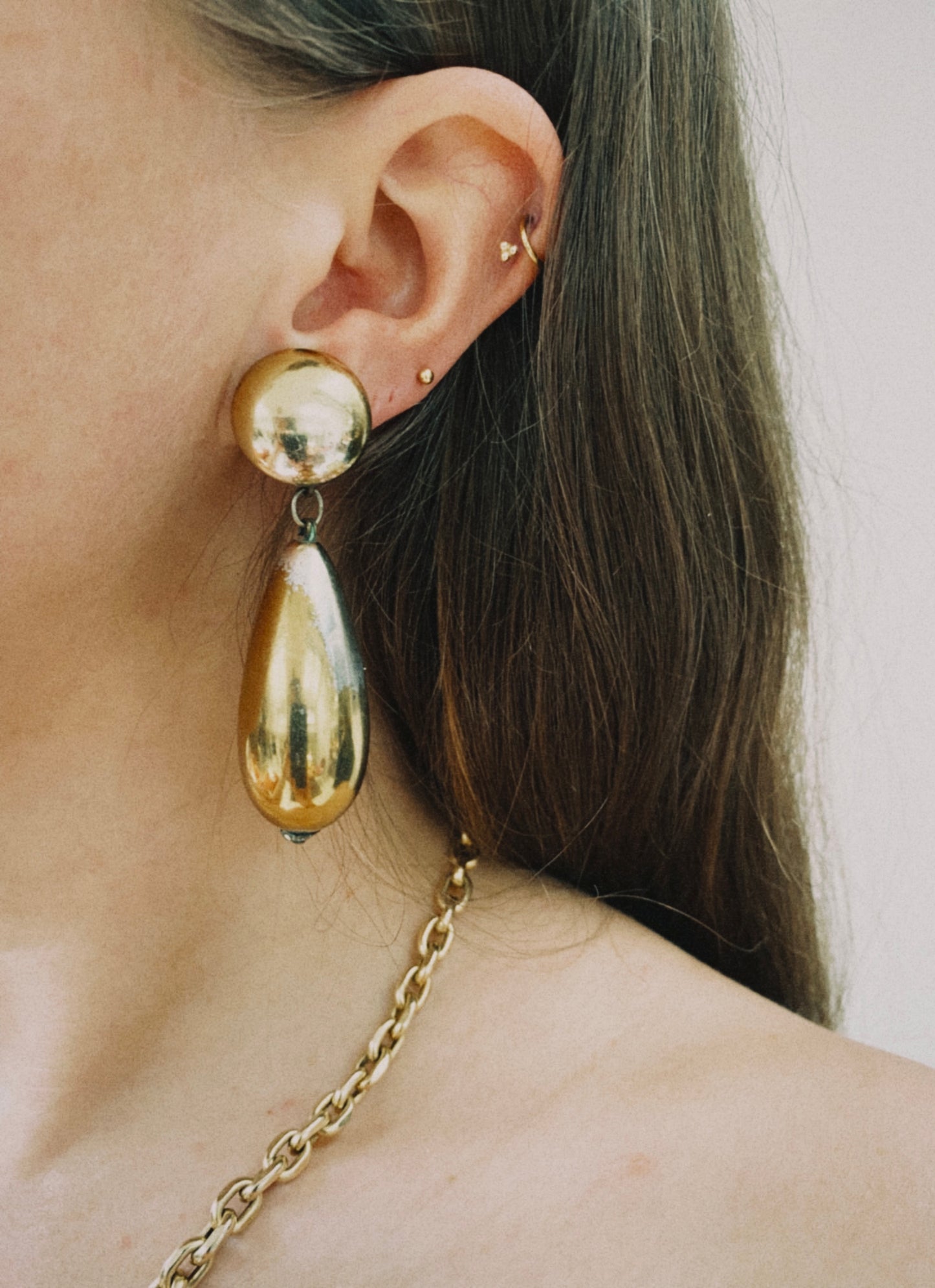 Vintage gold tone dangling tear clip on earrings