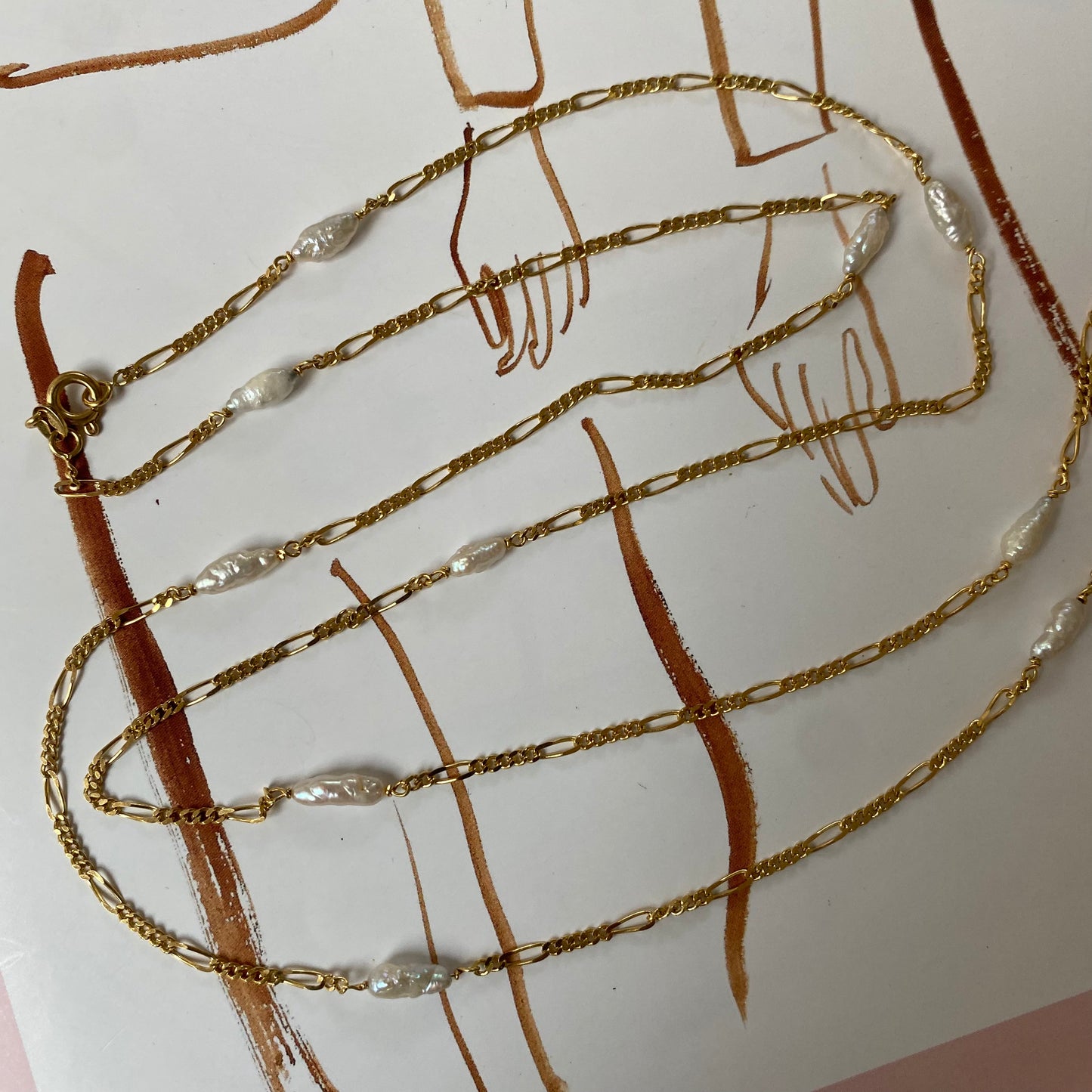 18 carat gold figaro chain necklace with pearls