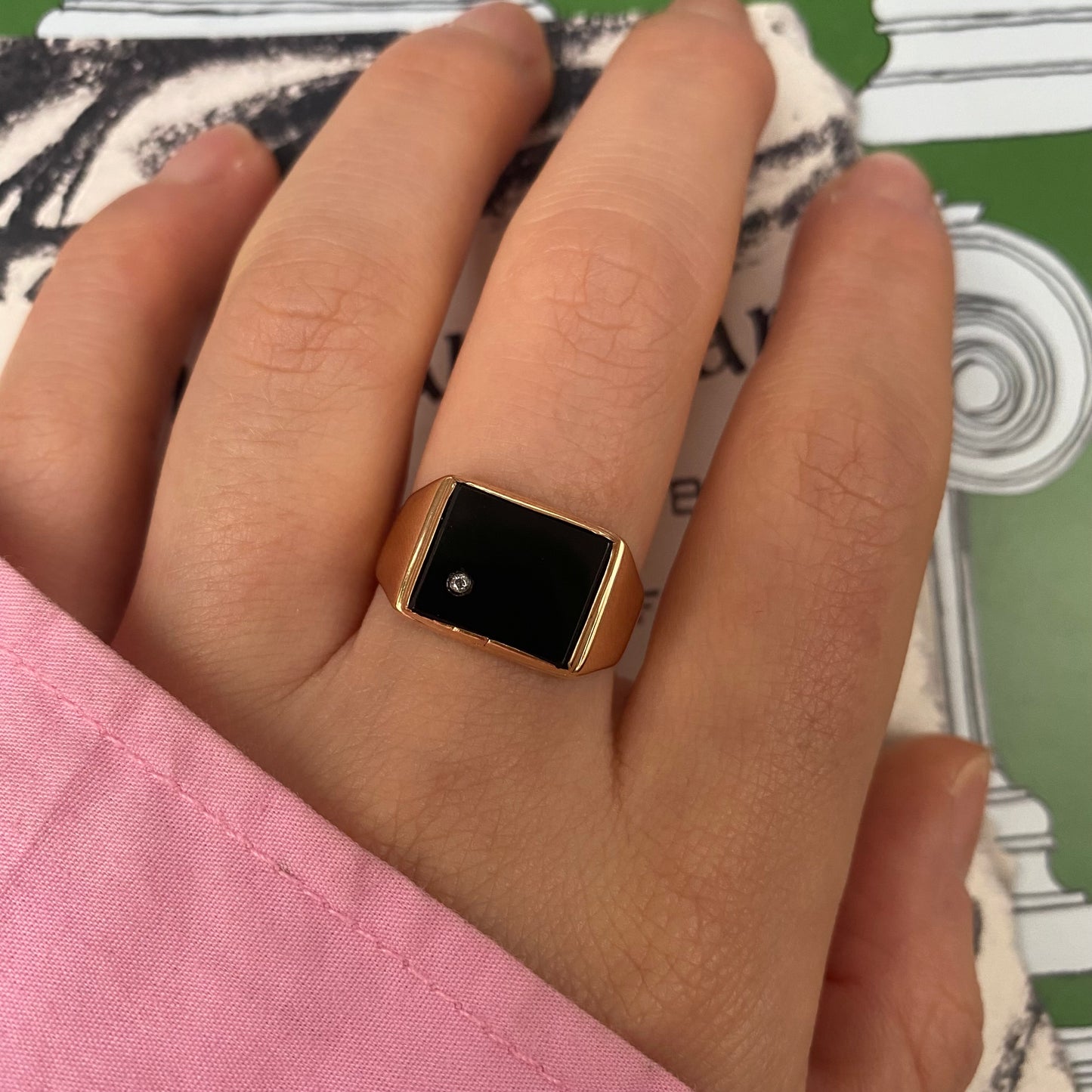 14 carat gold square onyx signet ring with small topaz