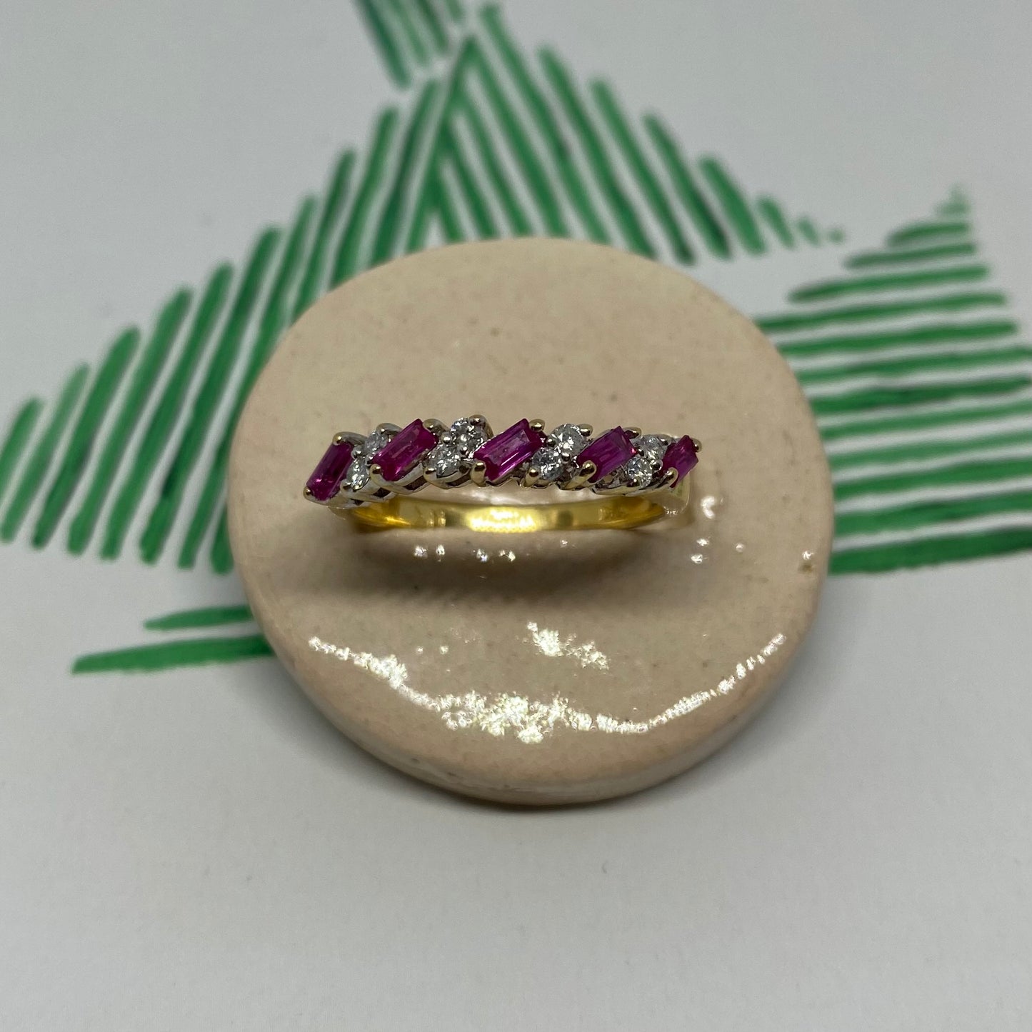 18 carat gold ruby and diamond half eternity ring