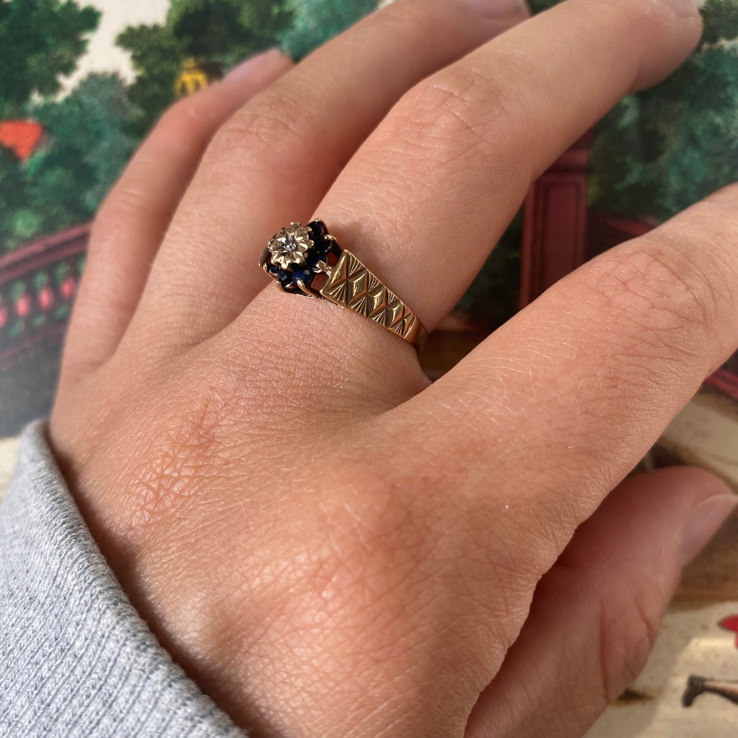 9 carat blue spinel and diamond daisy shape ring