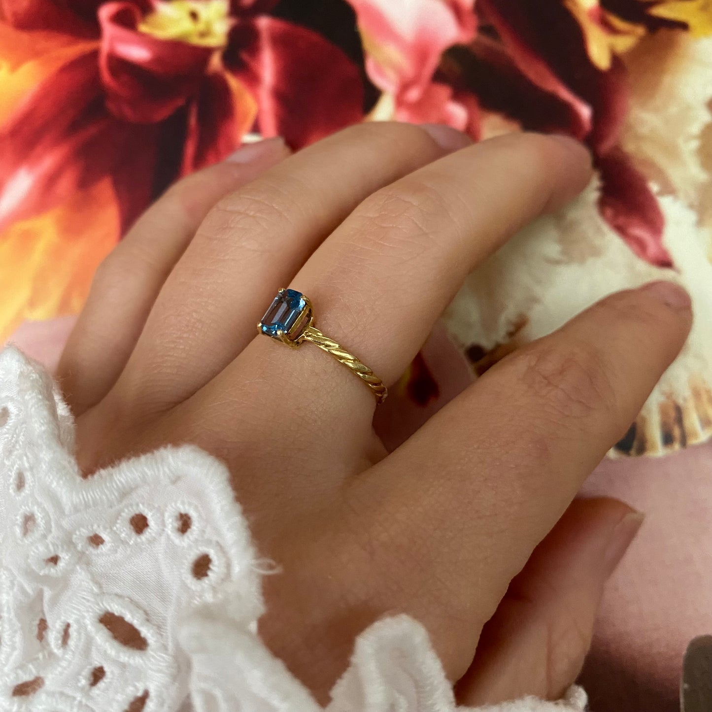 18 carat gold solitaire rectangle aquamarine ring with twisted band