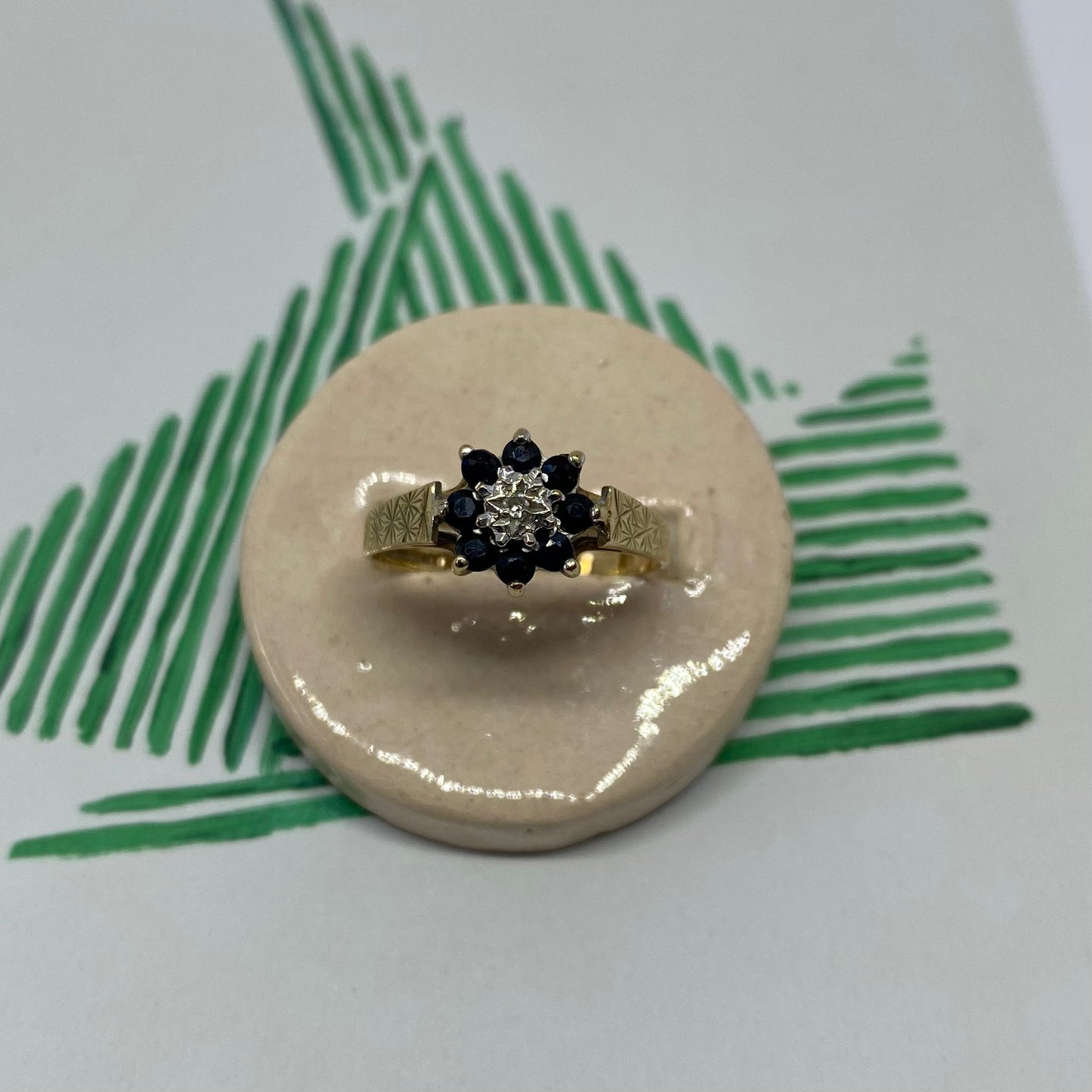 9 carat blue spinel and diamond daisy shape ring