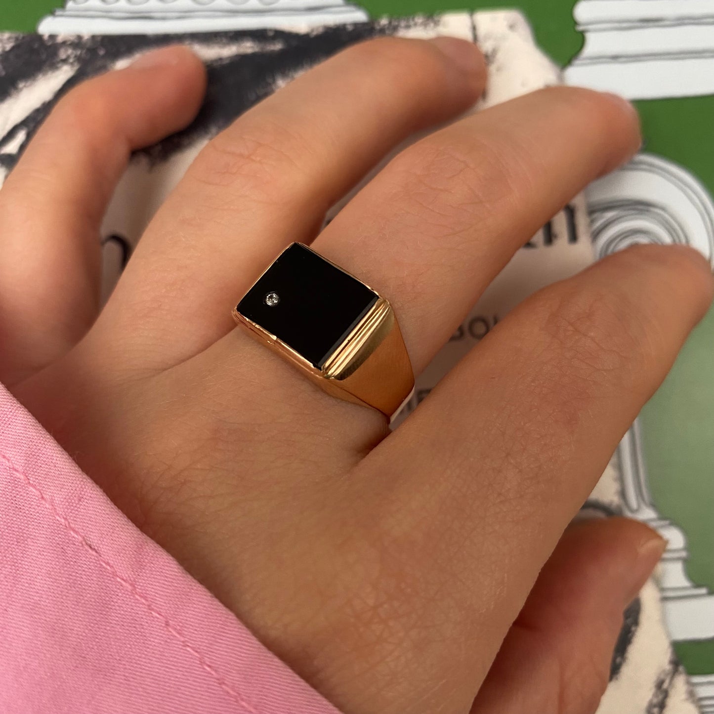 14 carat gold square onyx signet ring with small topaz
