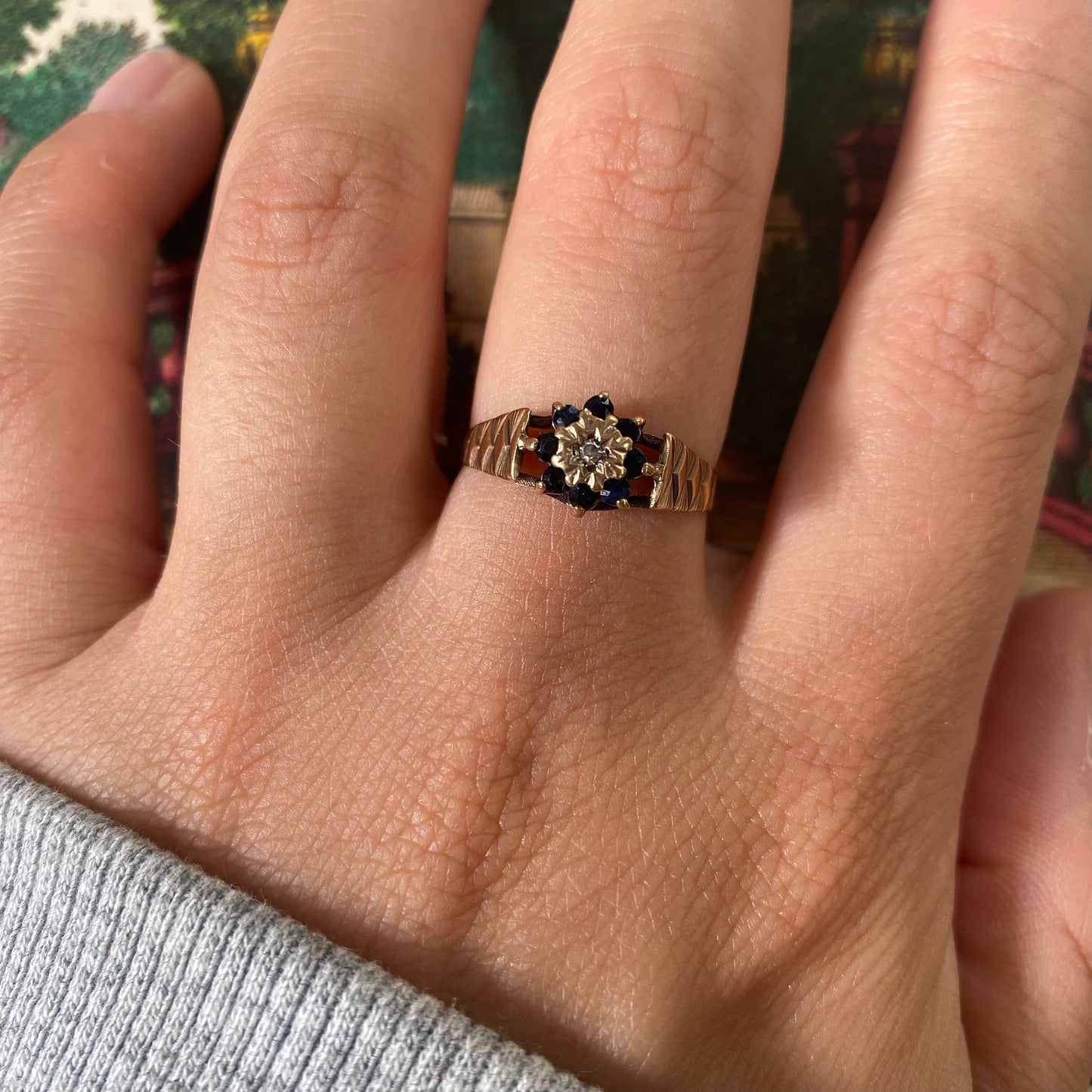 9 carat blue spinel and diamond daisy shape ring
