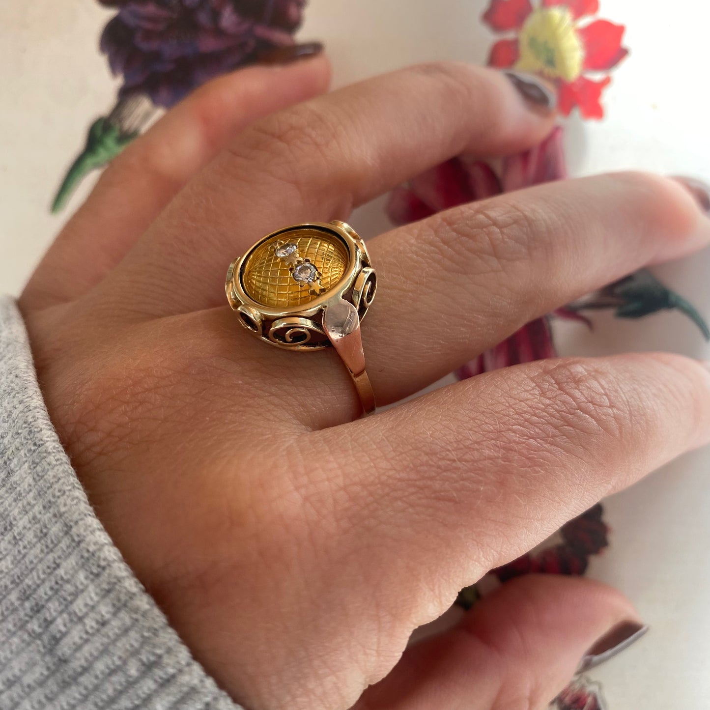 14 carat yellow and rose gold globe coin ring with diamonds