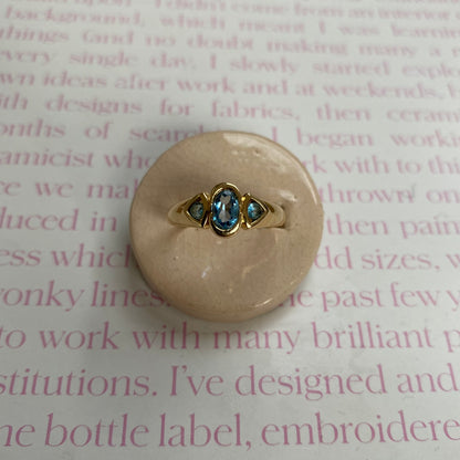 18 carat gold modern trilogy spinel ring