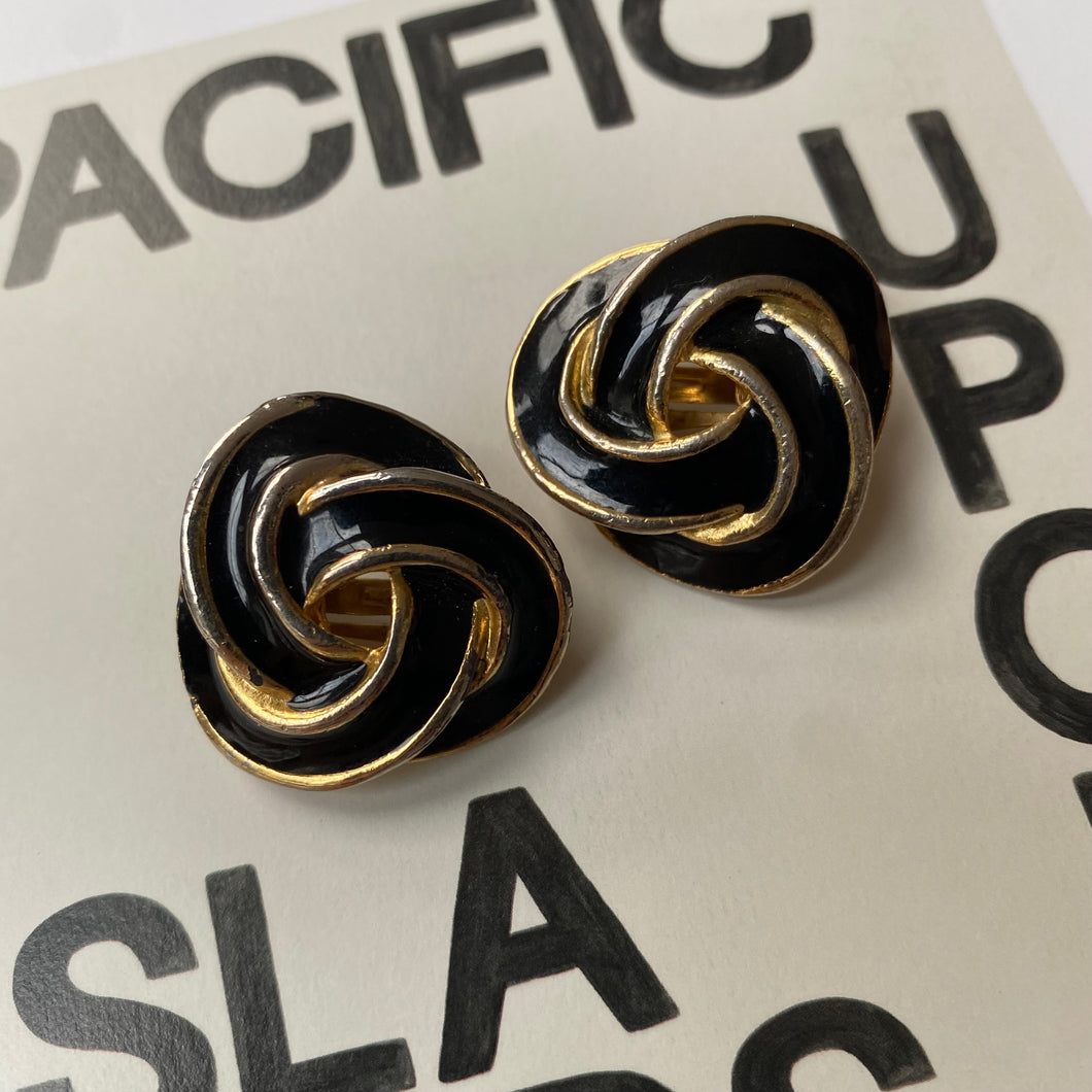 Vintage black and gold tone swirl clip on earrings