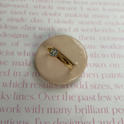 14 carat gold ring with solitaire light blue spinel