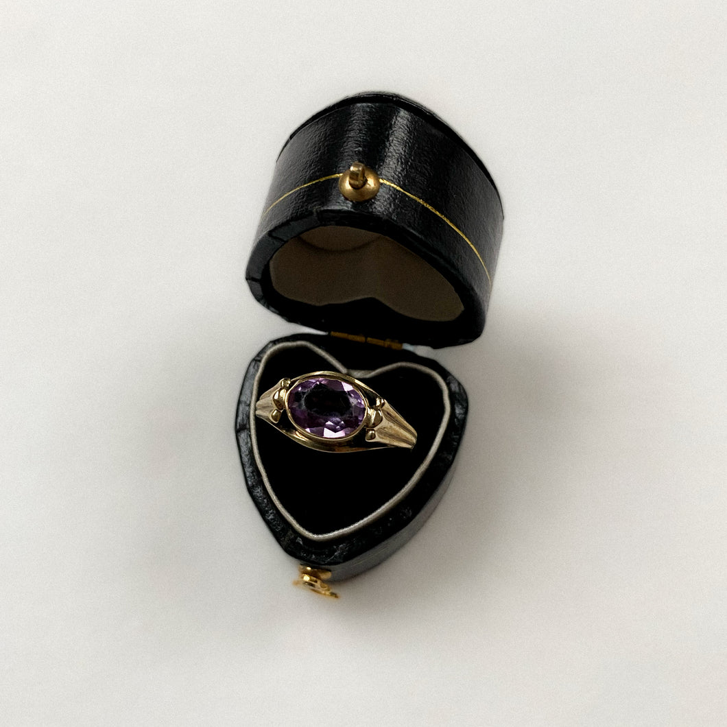 8 carat gold oval purple spinel with decorative sides