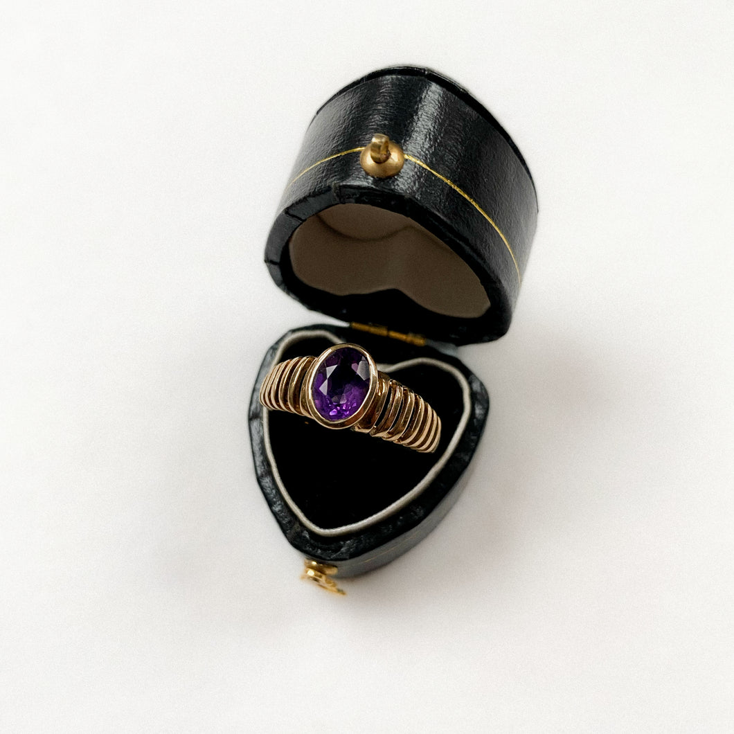 8 carat gold bold rible ring with oval amethyst