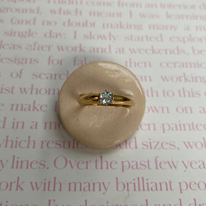 14 carat gold ring with solitaire light blue spinel