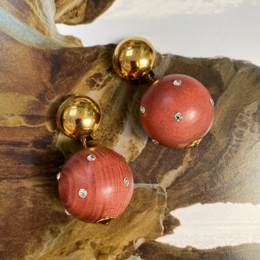 Vintage gold tone dome with dangling wooden ball clip on earrings