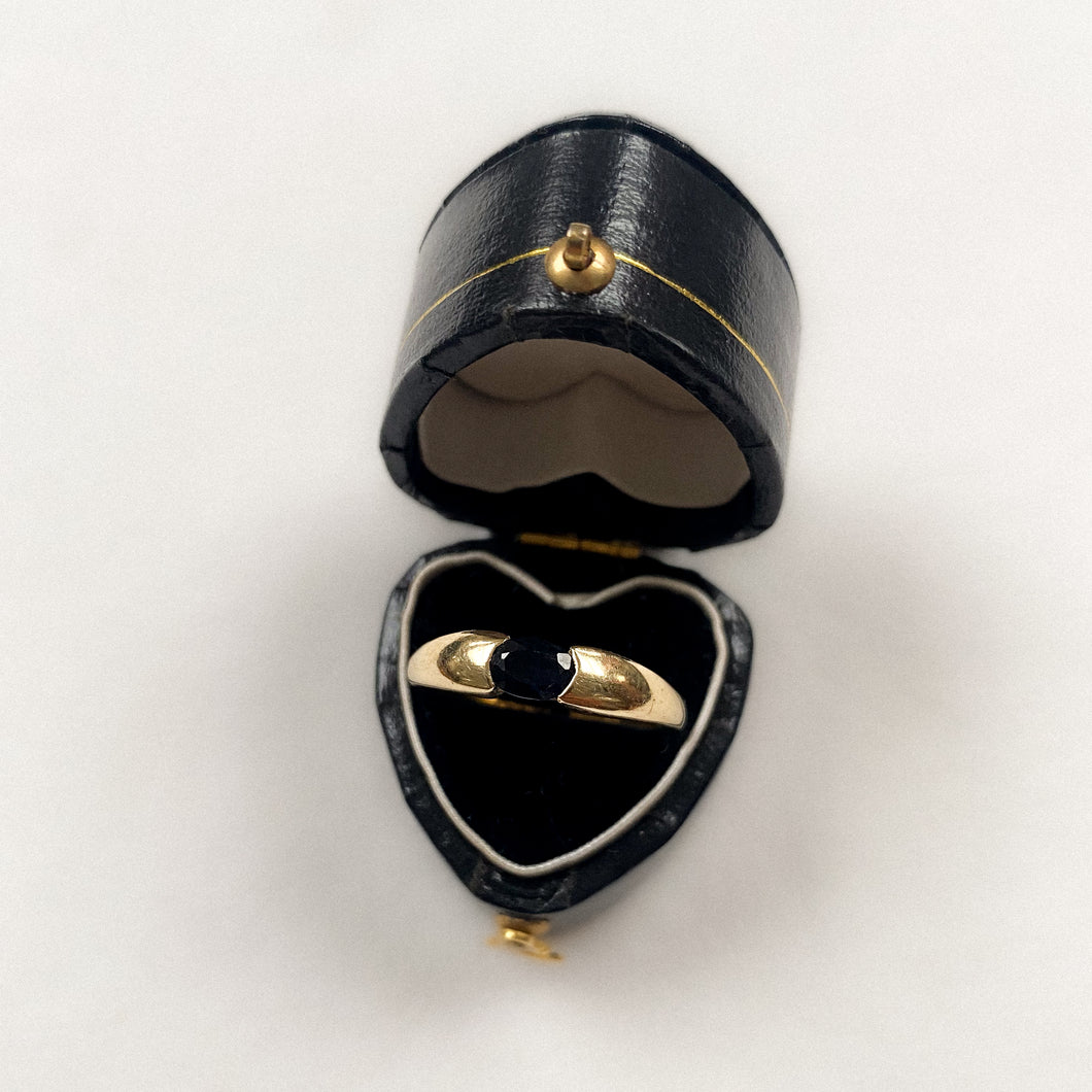 14 carat gold bold band ring with solitaire sapphire