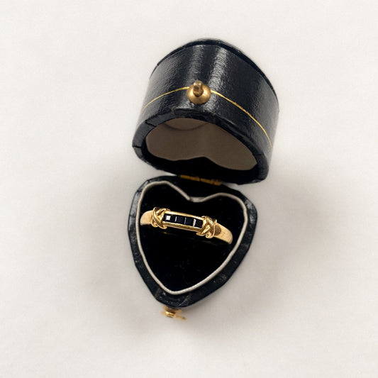 18 carat gold sapphire row with rope edges