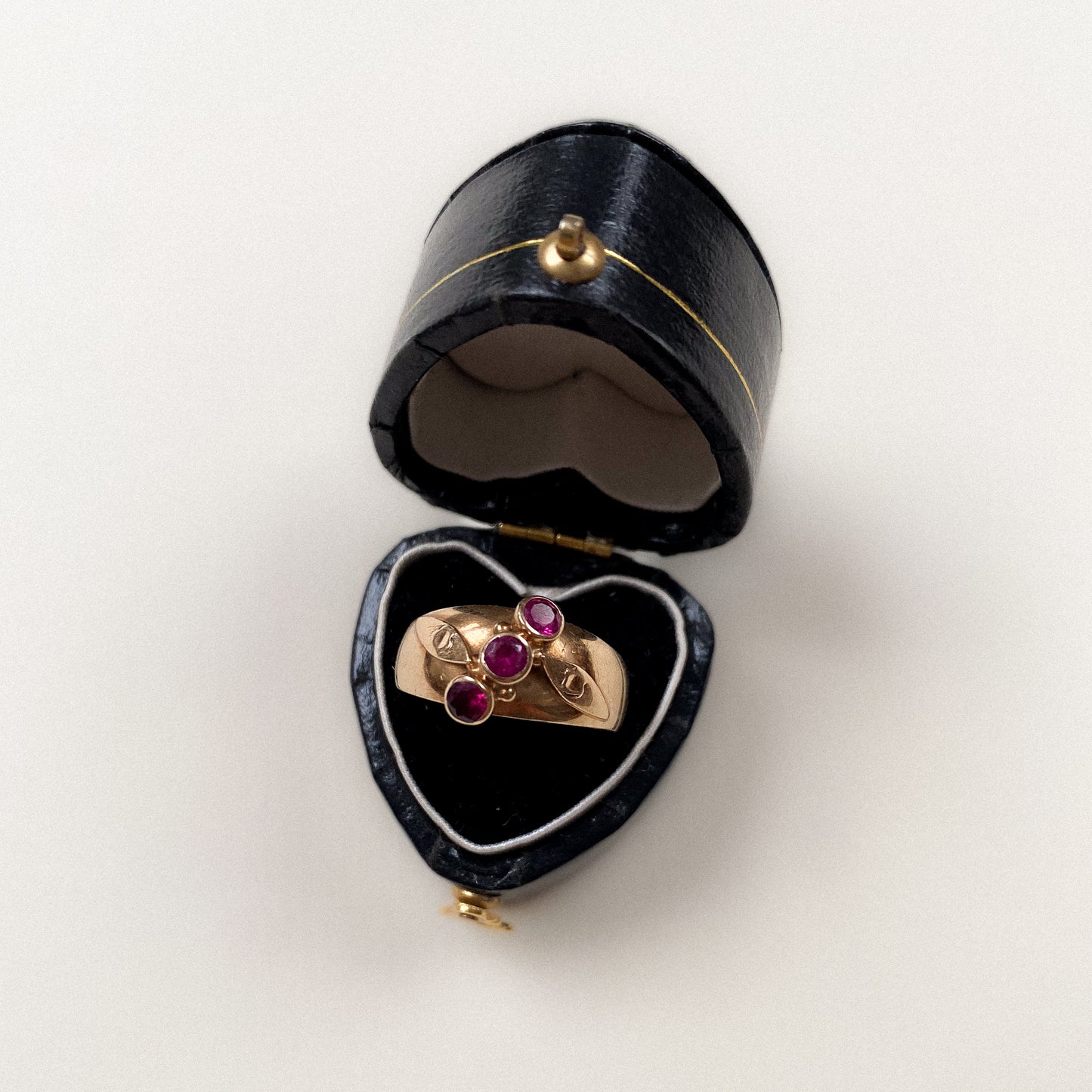 14 carat gold triple pink sapphire gypsy ring