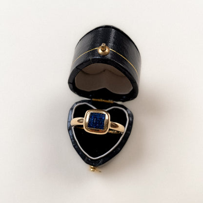 18 carat modern ring with square cut sapphire cluster