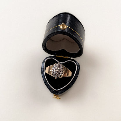 10 carat bold ring with oval diamond cluster