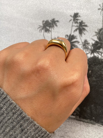 18 carat gold modern dome ring with row of diamonds