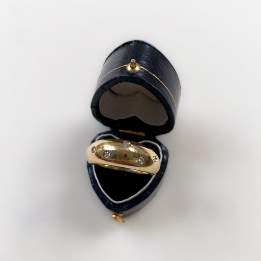 18 carat gold bold dome ring with diamonds