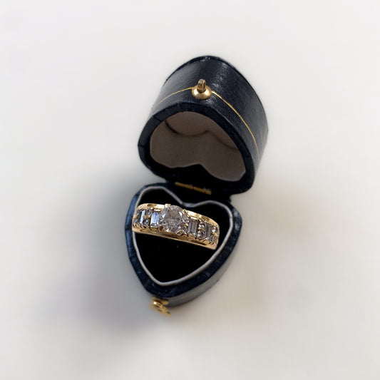 14 carat gold ring with baguette and round cut strass