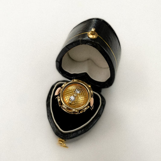 14 carat yellow and rose gold globe coin ring with diamonds