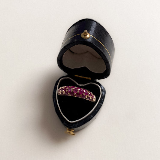 14 carat gold dome covered with ruby half eternity ring