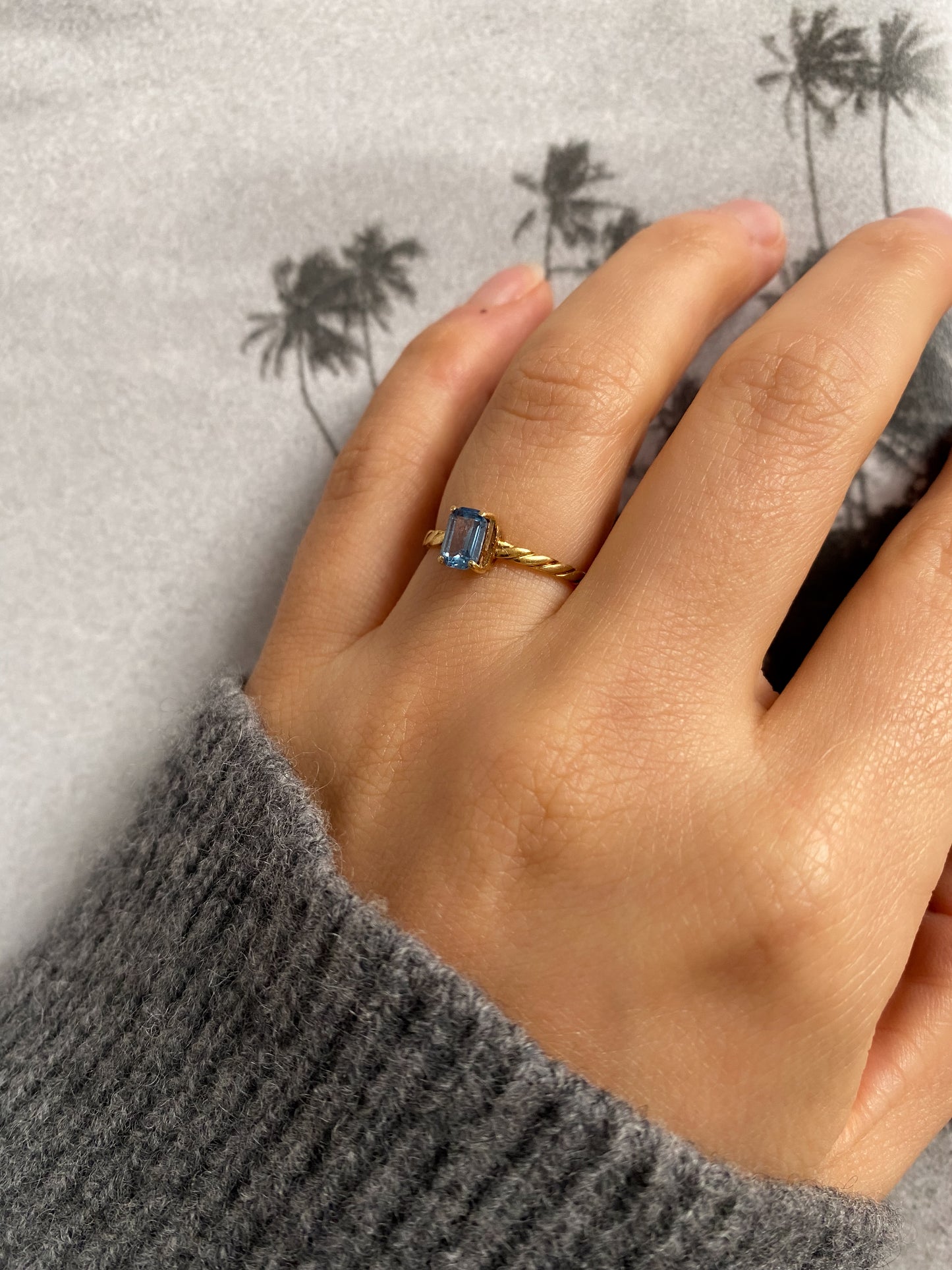 18 carat gold solitaire rectangle aquamarine ring with twisted band