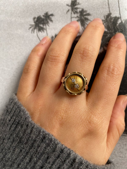 14 carat yellow and rose gold globe coin ring with diamonds