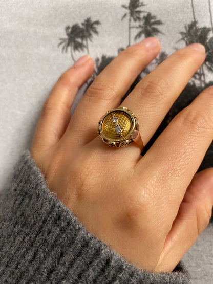 14 carat yellow and rose gold globe coin ring with diamonds