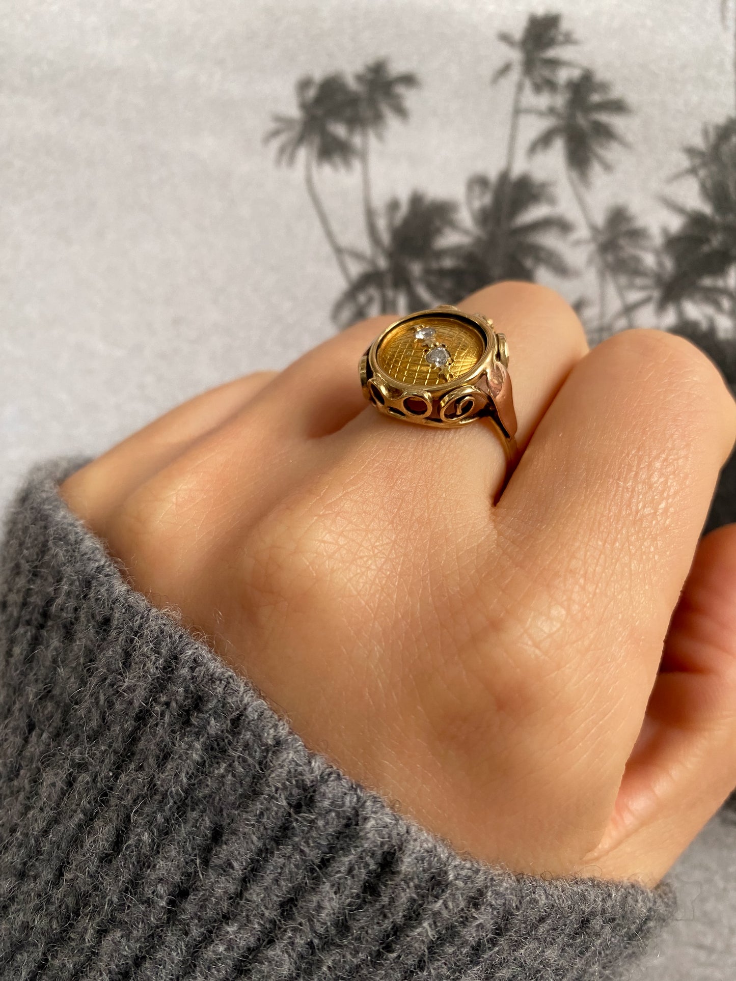 14 carat yellow and rose gold globe coin ring with diamonds