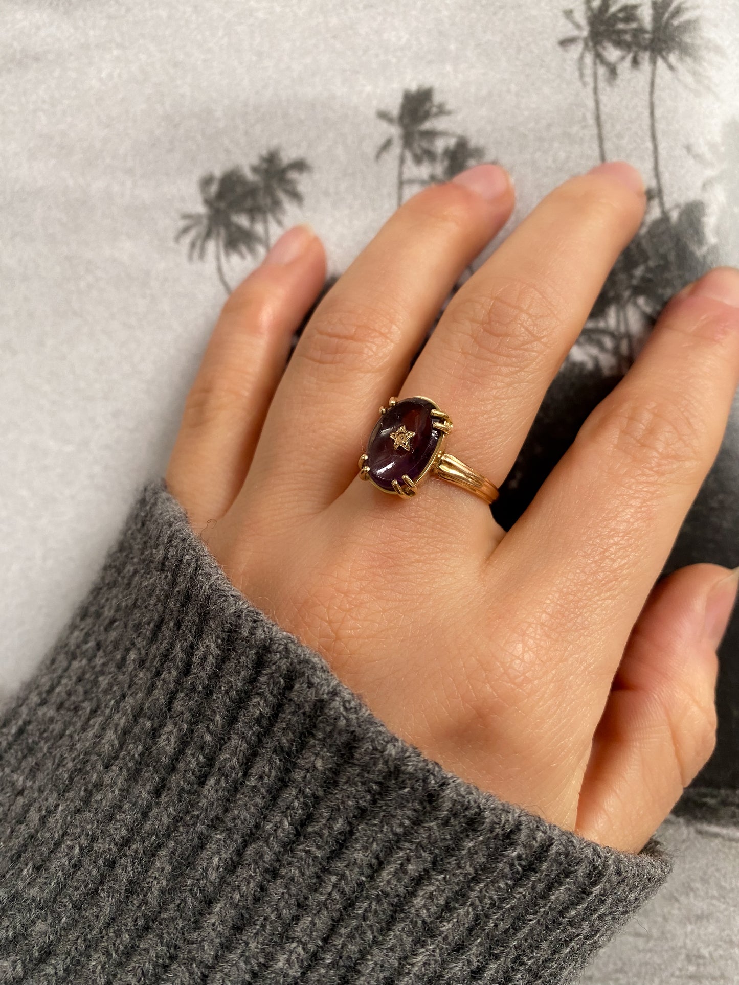 18 carat gold amethyst statement ring with center star