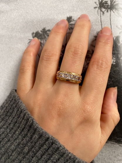 14 carat gold half eternity ring with baguette and round cut strass