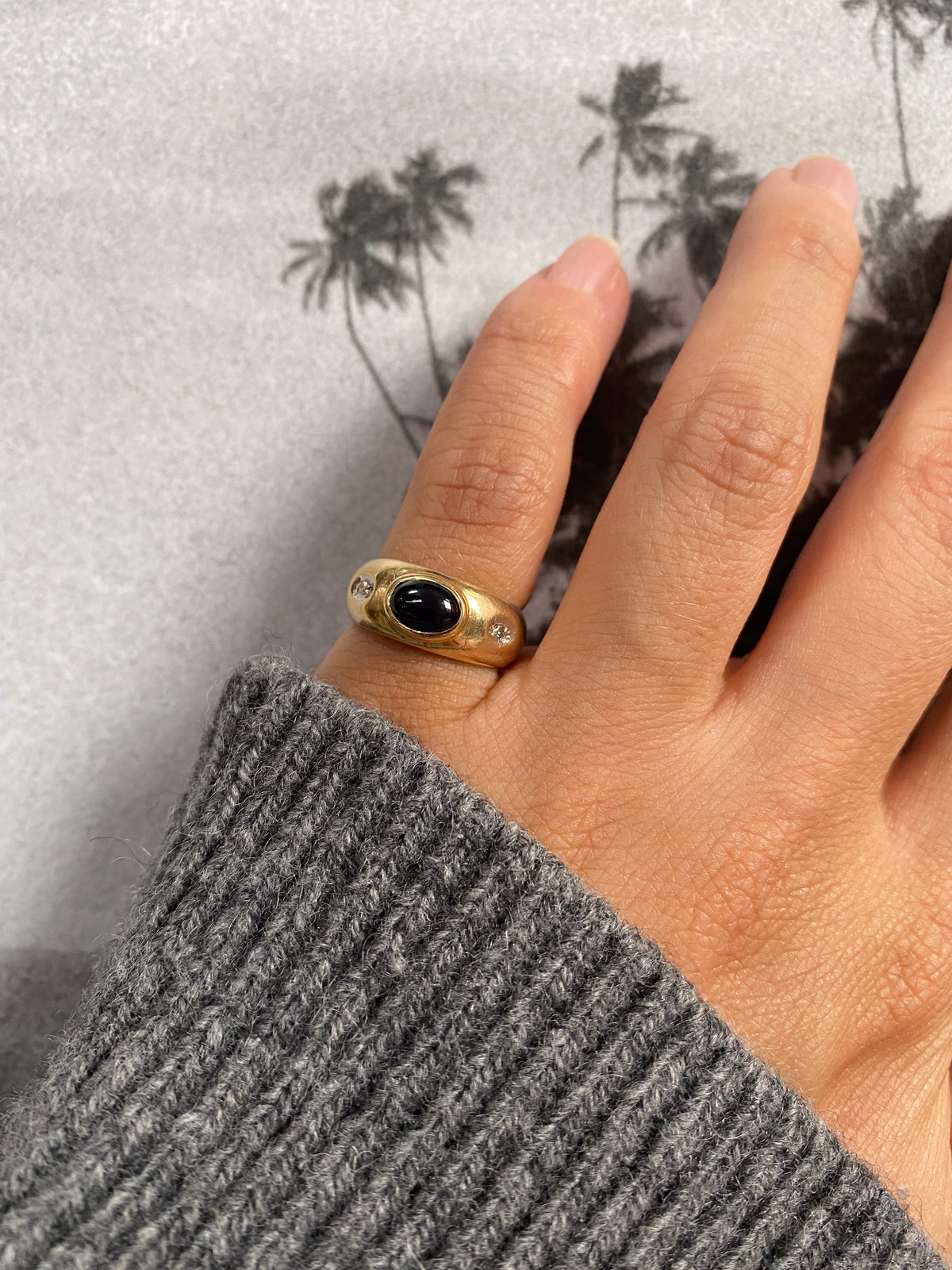 14 carat gold gypsy ring with diamond and oval onyx