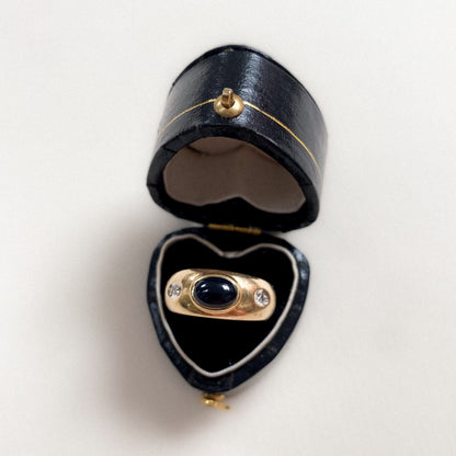 14 carat gold gypsy ring with diamond and oval onyx