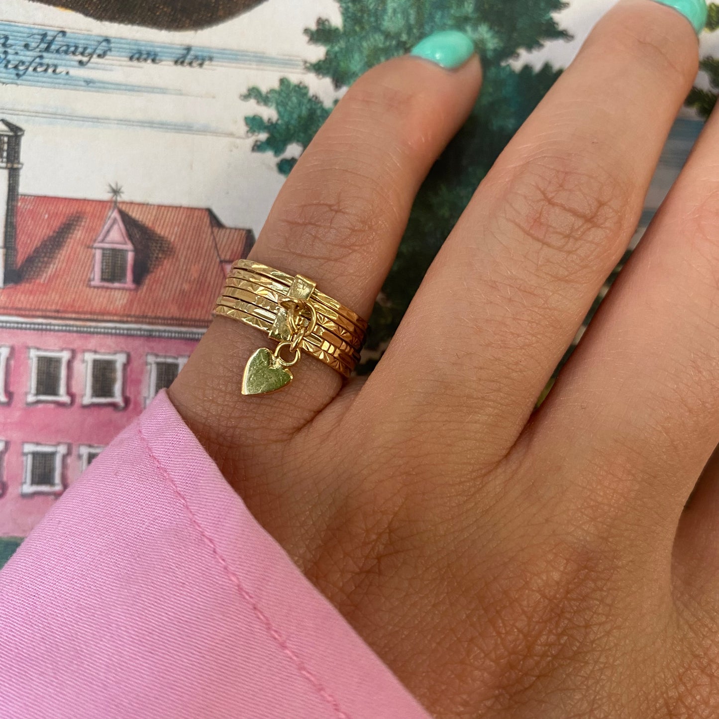 18 carat gold 6 engraved stack ring with heart pendant