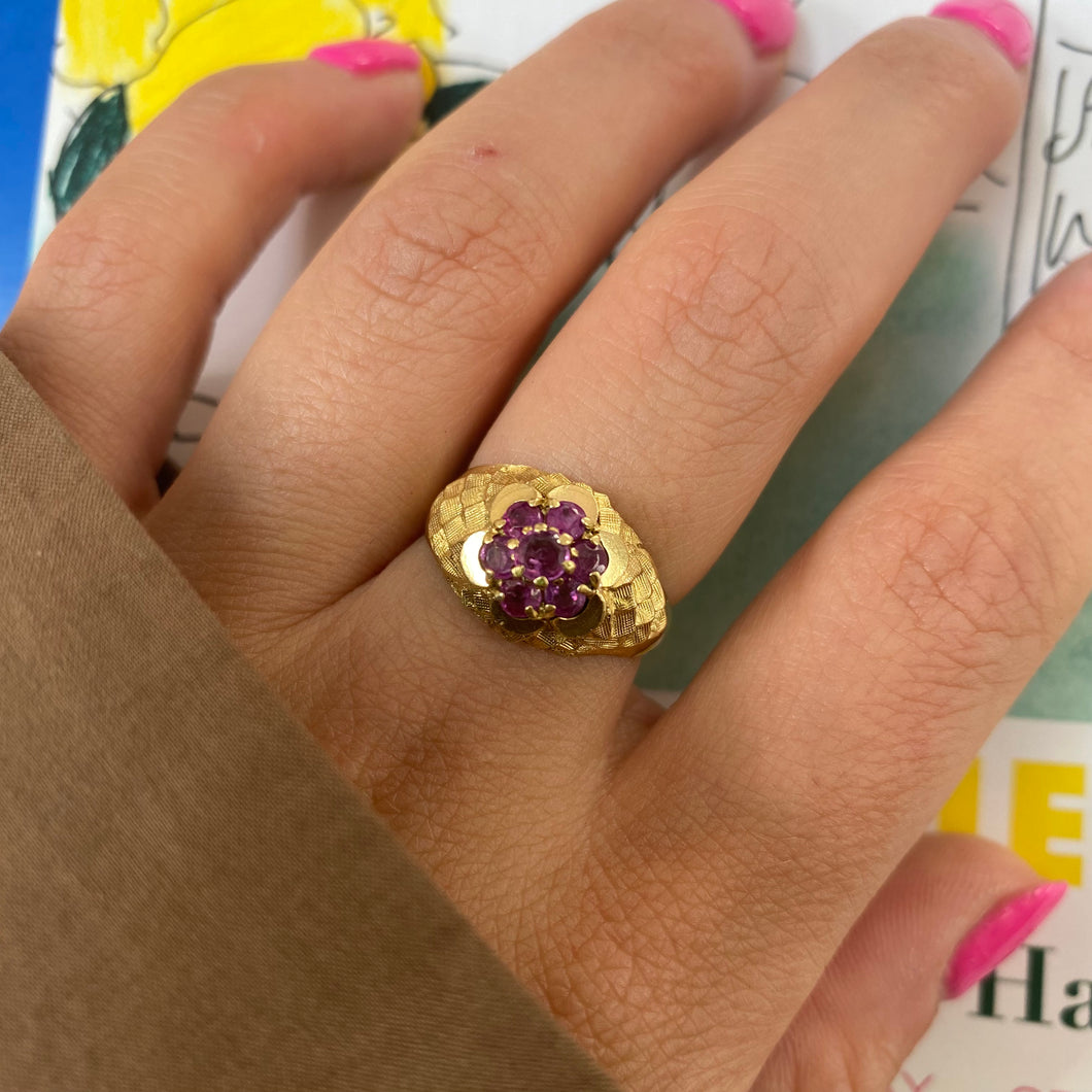 18 carat gold ruby daisy ring with decorative sides
