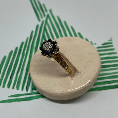 9 carat blue spinel and diamond daisy shape ring