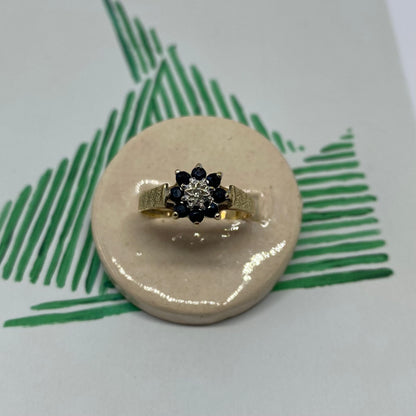 9 carat blue spinel and diamond daisy shape ring