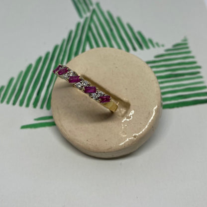 18 carat gold ruby and diamond half eternity ring