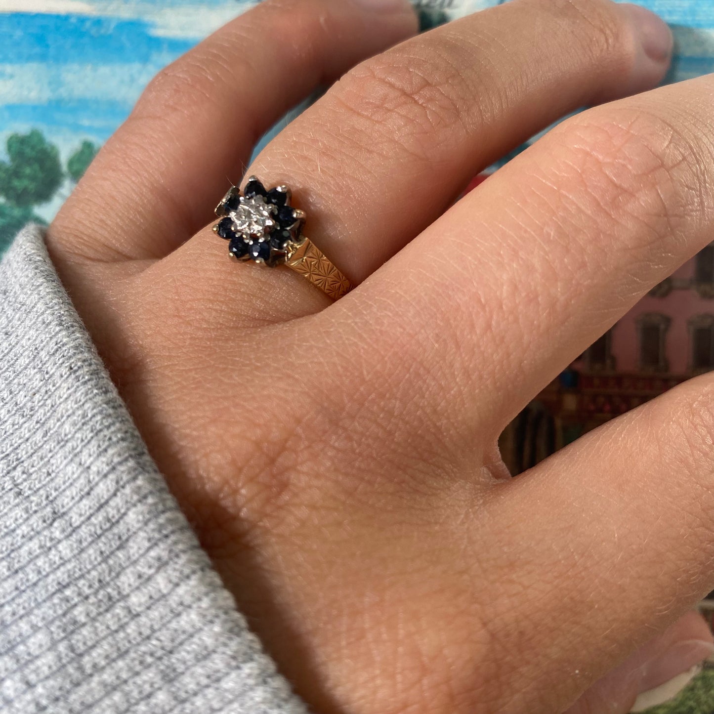 9 carat blue spinel and diamond daisy shape ring